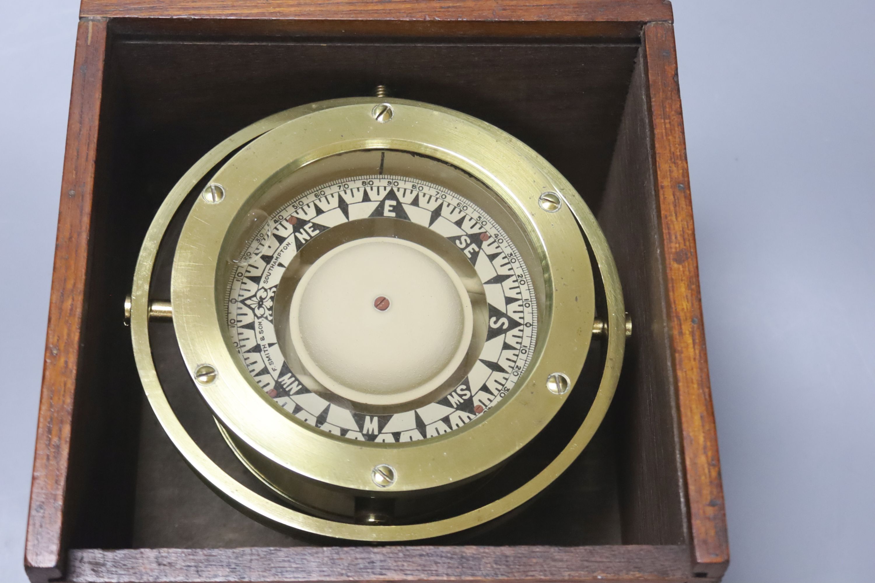 A mahogany cased brass marine compass on gimbal, marked F Smith & Son, Southampton.